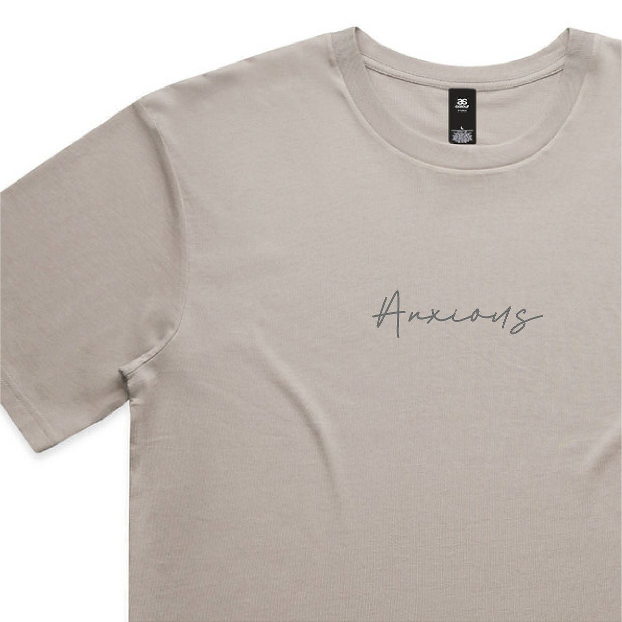 Beige t-shirt with 'Anxious' text on a white background