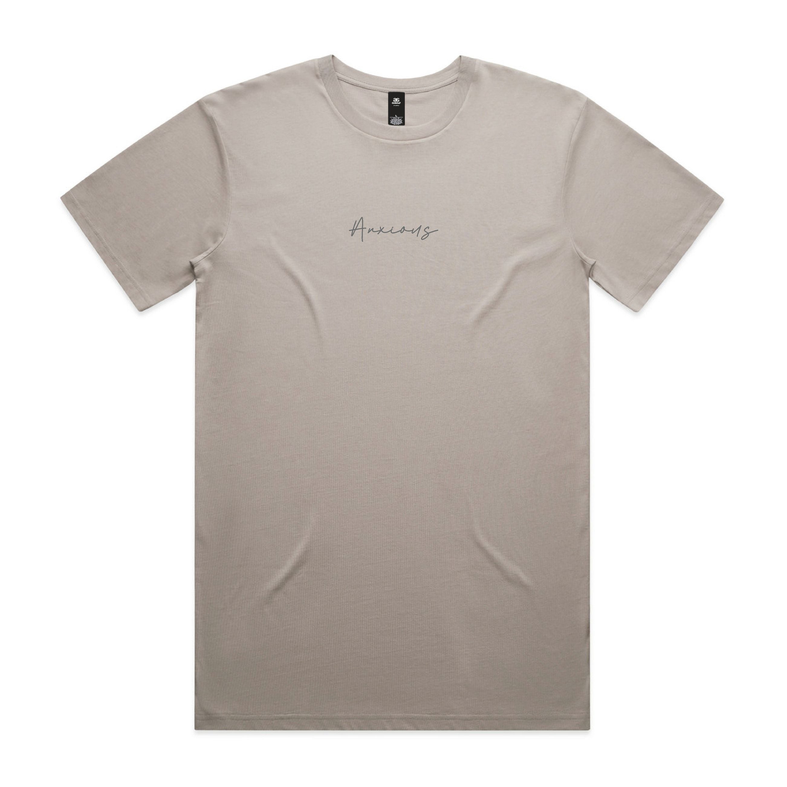 Beige t-shirt with 'Anxious' text on a white background