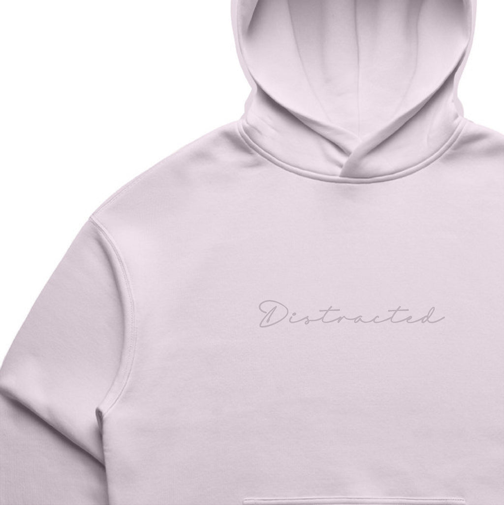 Orchid colour hoodie with 'Distracted' text on a white background