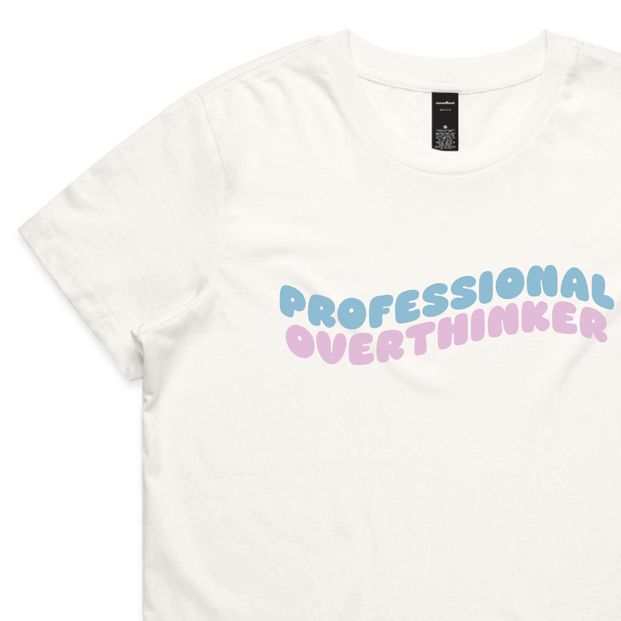 White t-shirt with 'PROFESSIONAL OVERTHINKER' text in pastel colors on a white background