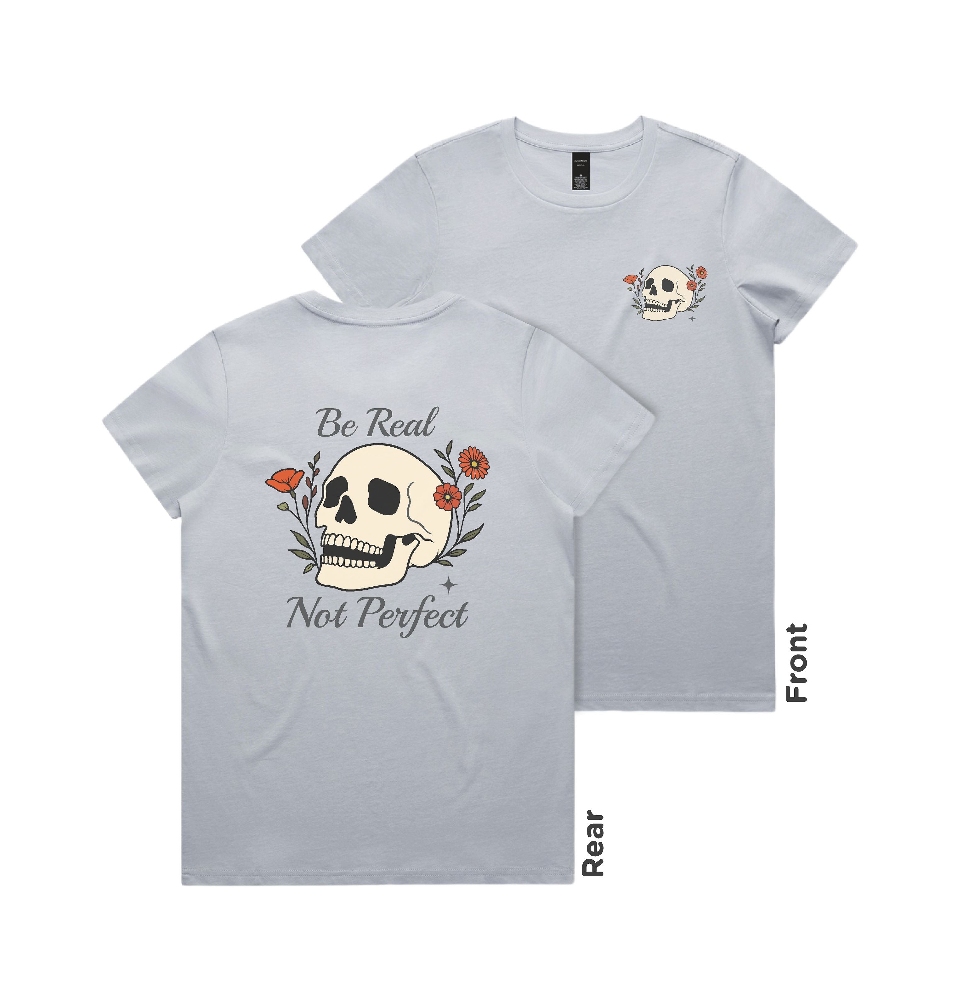 Gray t-shirt with skull design and text 'Be Real Not Perfect' on a white background
