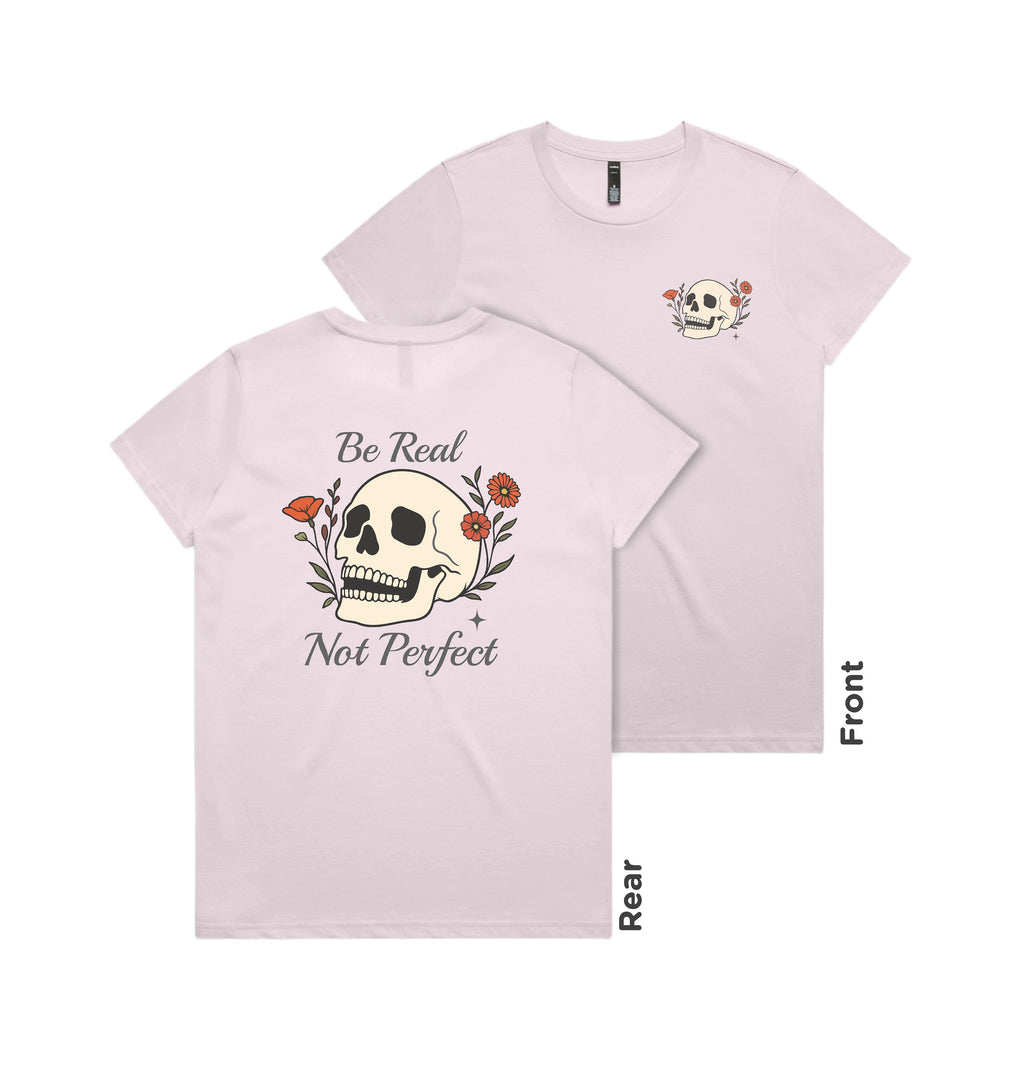 Light pink t-shirt with skull and floral design on front and text 'Be Real Not Perfect' on back